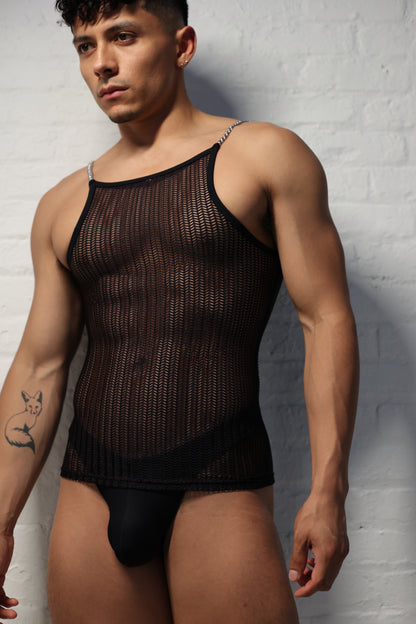 Model wearing black netted mesh tank top with metal chain straps from Fabian Divani Studio showing textured pattern detail