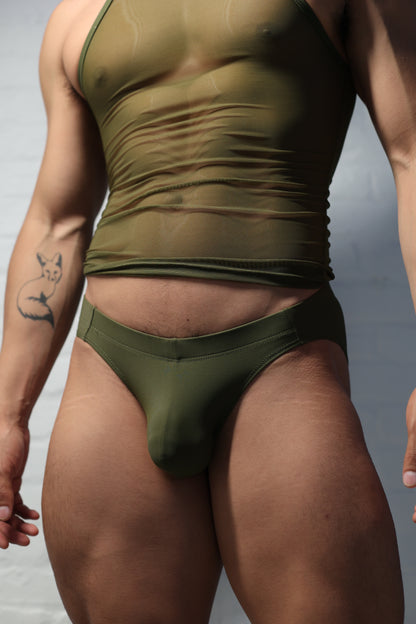 Model wearing olive green men's underwear from Fabian Divani vers collection showing comfortable fit and military-inspired color